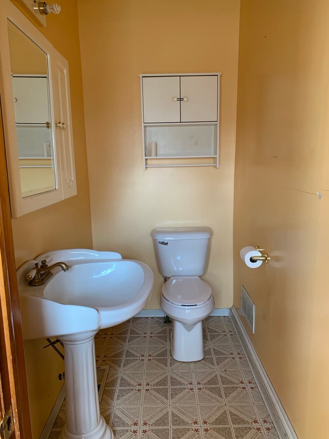 Half bath before — Acorn Properties renovation